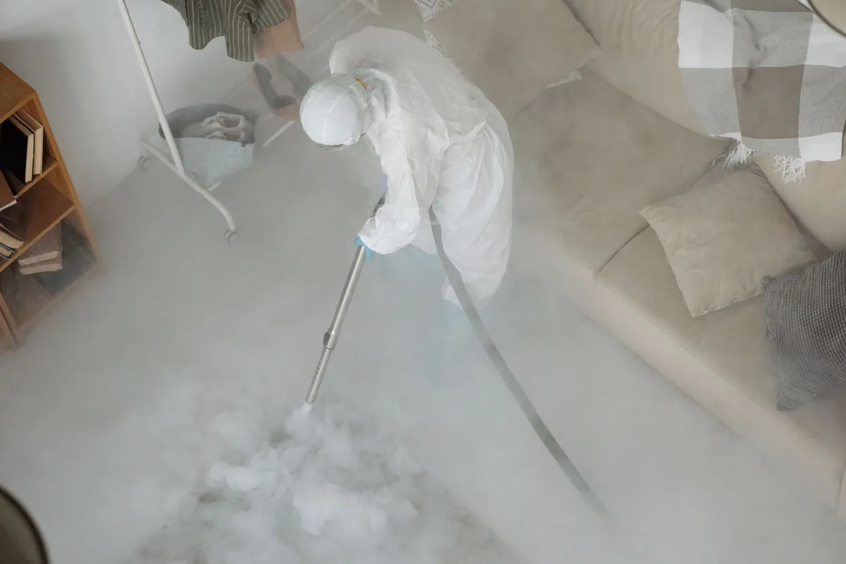 Biohazard cleanup technician in protective equipment, West End-Cobb Town, AL